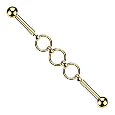 Zlacený industrial piercing s kroužky